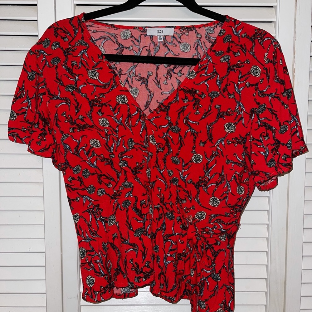 Red floral blouse